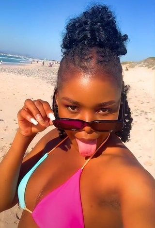 Hot mpho pink Shows Cleavage in Bikini Top at the Beach