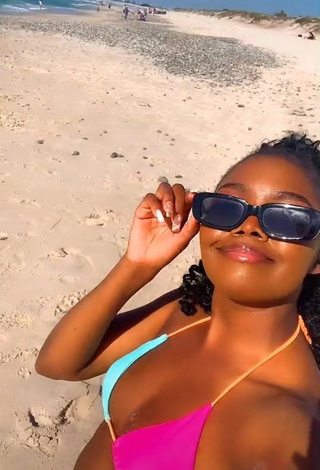 3. Hot mpho pink Shows Cleavage in Bikini Top at the Beach