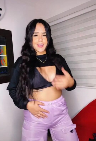 Alluring Nicole Diaz Shows Cleavage in Erotic Black Crop Top