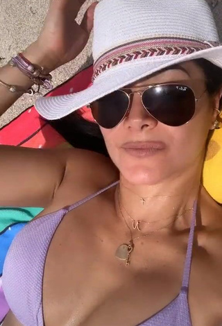 Cute Norkys Batista Shows Cleavage in Violet Bikini at the Beach