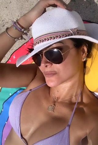 4. Cute Norkys Batista Shows Cleavage in Violet Bikini at the Beach