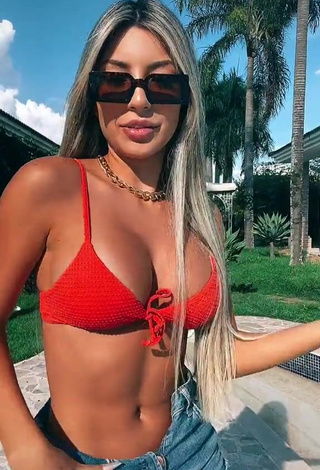 4. Sweetie Raffaela Souza Shows Cleavage in Orange Bikini Top