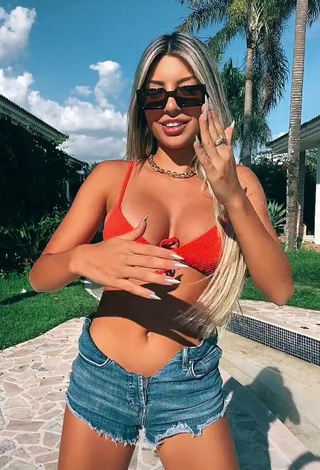 Sexy Raffaela Souza Shows Cleavage in Orange Bikini Top