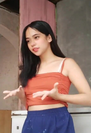 Hot Rhanzelle Shows Cleavage in Orange Crop Top