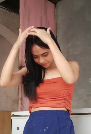 3. Hot Rhanzelle Shows Cleavage in Orange Crop Top