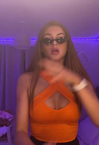 Hottie Sophie Aspin Shows Cleavage in Orange Top