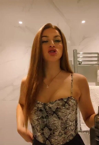 1. Beautiful Sophie Aspin Shows Cleavage in Sexy Snake Print Top