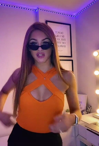 1. Hot Sophie Aspin Shows Cleavage in Orange Top