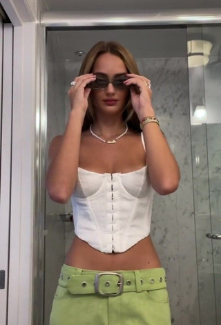 Hot Suede Brooks Shows Cleavage in White Corset