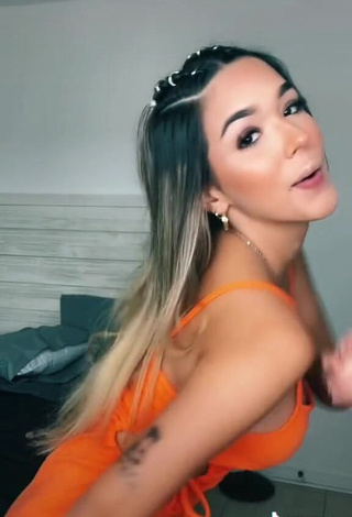 4. Sexy Susana Torres Shows Cleavage in Orange Dress