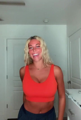 1. Hot Tiffany Jeffcoat Shows Cleavage in Orange Sport Bra