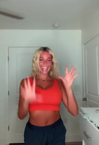 Hot Tiffany Jeffcoat Shows Cleavage in Orange Sport Bra