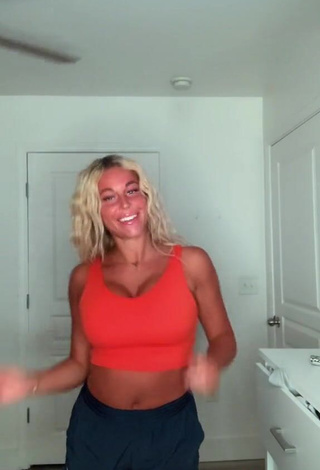 4. Hot Tiffany Jeffcoat Shows Cleavage in Orange Sport Bra