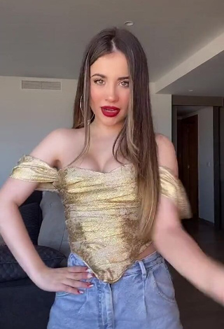 Sexy Valeria Monerri Shows Cleavage in Golden Corset