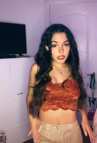 3. Hot Alejandra Olivera Shows Cleavage in Orange Tube Top