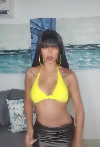 1. Hot Aliany García Shows Cleavage in Yellow Bikini Top