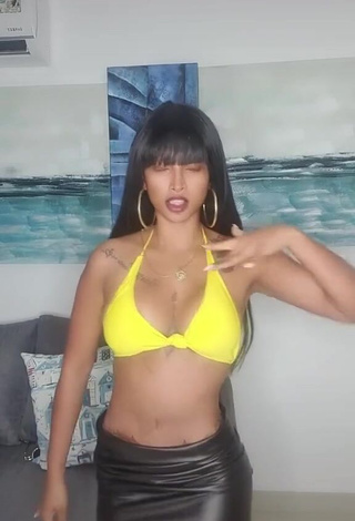 Hot Aliany García Shows Cleavage in Yellow Bikini Top