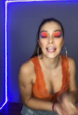 4. Sexy Azul Granton Shows Cleavage in Orange Top