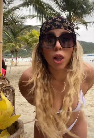 4. Seductive Chantall Pizzino Shows Cleavage in White Bikini at the Beach