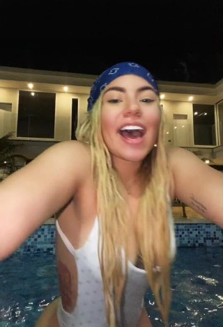1. Hot Chantall Pizzino Shows Cleavage in White Swimsuit at the Pool
