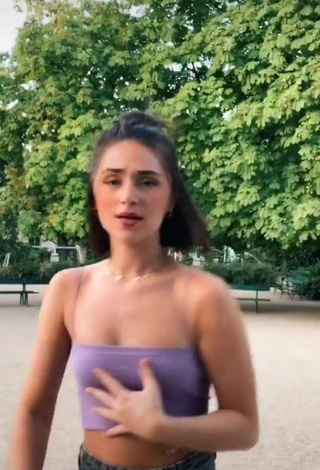 Sexy Fleur Shows Cleavage in Purple Crop Top