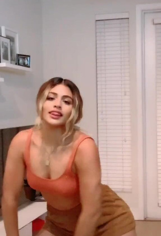 3. Magnetic Gabriela Bandy Shows Cleavage in Appealing Orange Crop Top and Bouncing Boobs