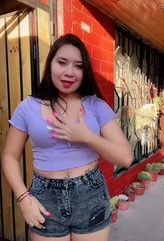 Cute Christel Quiroz Shows Cleavage in Purple Crop Top