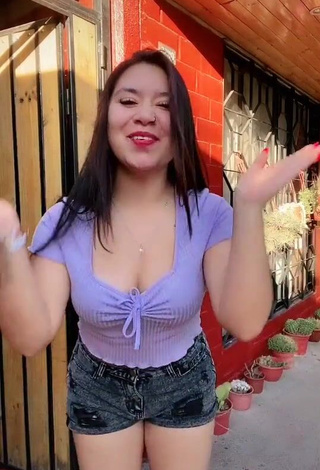 3. Cute Christel Quiroz Shows Cleavage in Purple Crop Top