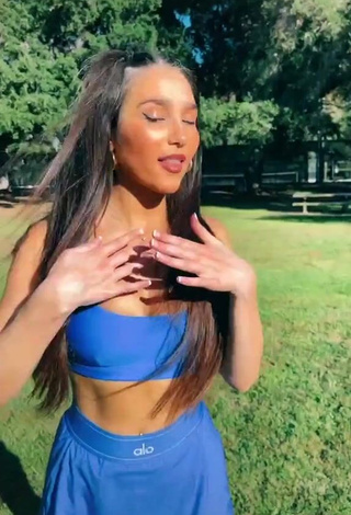 1. Hot Iris Shows Cleavage in Blue Crop Top