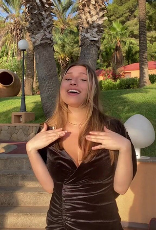 4. Hot Lucy Lacht Shows Cleavage in Black Dress