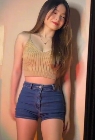 Beautiful Madelaine Red Shows Cleavage in Sexy Beige Crop Top