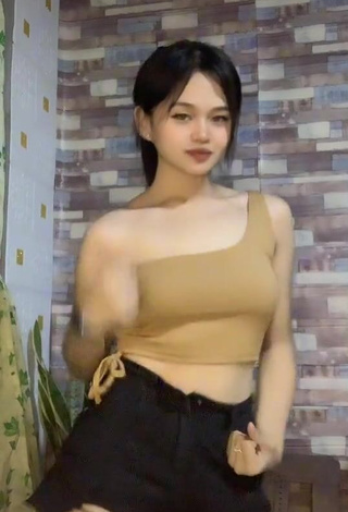 3. Sexy Telly Shows Cleavage in Beige Crop Top