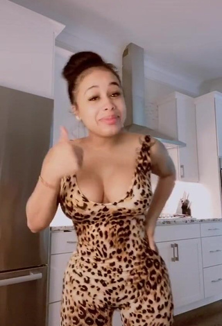 Desirable DreamDoll Shows Cleavage in Leopard Bodysuit