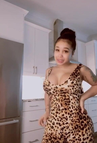 3. Desirable DreamDoll Shows Cleavage in Leopard Bodysuit