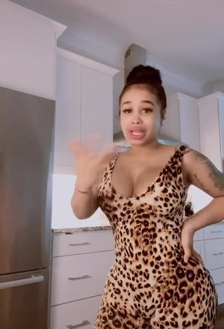 4. Desirable DreamDoll Shows Cleavage in Leopard Bodysuit