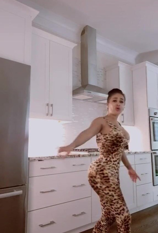 1. Hottie DreamDoll Shows Cleavage in Leopard Bodysuit