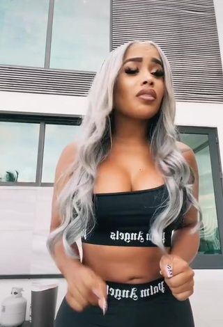 1. Sexy DreamDoll Shows Cleavage in Black Crop Top