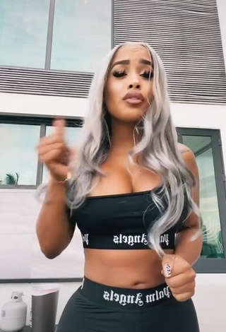 Sexy DreamDoll Shows Cleavage in Black Crop Top