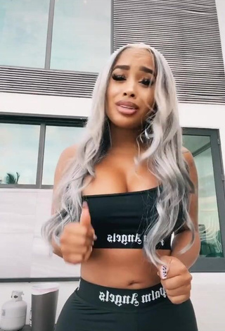 3. Sexy DreamDoll Shows Cleavage in Black Crop Top