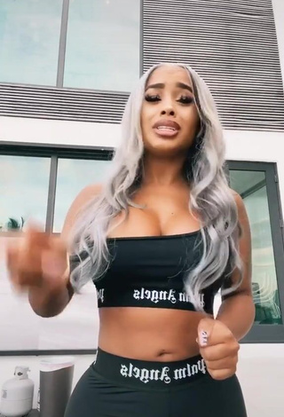 4. Sexy DreamDoll Shows Cleavage in Black Crop Top