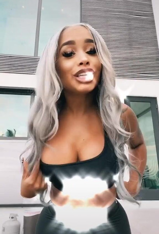 1. Cute DreamDoll Shows Cleavage in Black Crop Top