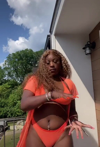 Dazzling Skaibeauty Shows Cleavage in Inviting Orange Bikini