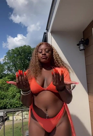 3. Dazzling Skaibeauty Shows Cleavage in Inviting Orange Bikini