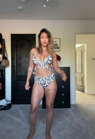 Desirable Atqofficial Shows Cleavage in Snake Print Swimsuit