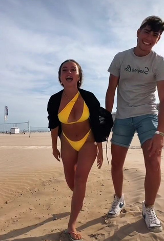 Sexy Celia Pergo Shows Cleavage in Yellow Bikini at the Beach