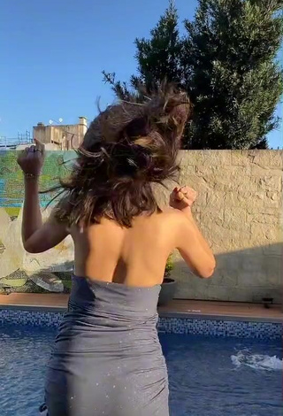 3. Hot Dai Amadeo Shows Cleavage in Grey Dress at the Swimming Pool