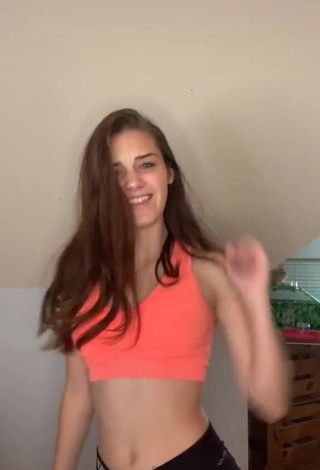 1. Sweetie Faith Moormeier Shows Cleavage in Orange Crop Top