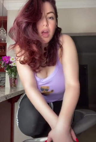 3. Sexy Jane Rocci Shows Cleavage in Purple Tank Top