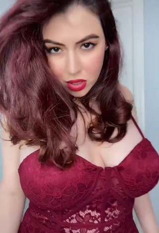 Sexy Jane Rocci Shows Cleavage in Red Bodysuit