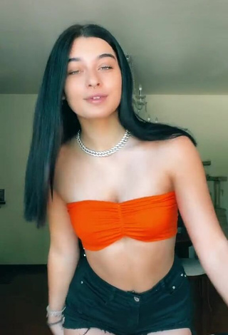 1. Sexy Sofia Crisafulli Shows Cleavage in Orange Tube Top